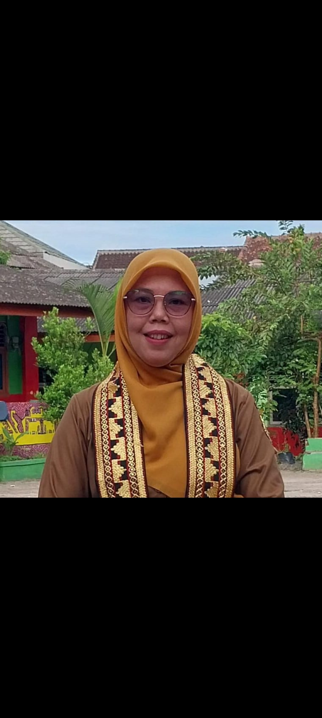 Foto Erli Lasmita,S.Pd